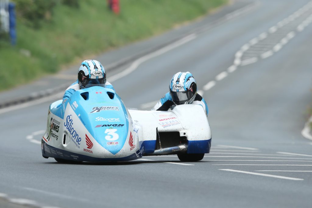 DAVE KNEEN/PACEMAKER PRESS, BELFAST: 10/06/2016: John Holden and Andy Winkle (LCR Honda - Silicone Engineering/Barnes Racing) at Bedstead during the Sure Mobile Sidecar TT race.
