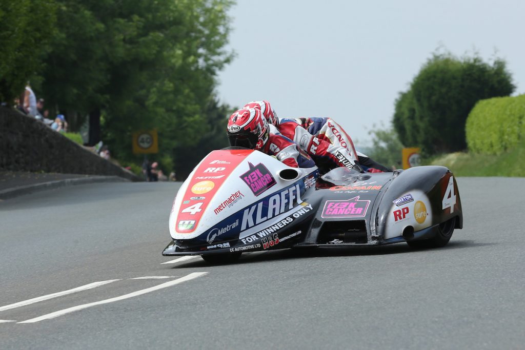 DAVE KNEEN/PACEMAKER PRESS, BELFAST: 10/06/2016: Tim Reeves and Patrick Farrance at Signpost Corner during the Sure Mobile Sidecar TT race.
