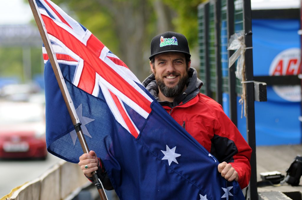 PACEMAKER BELFAST 29/05/13: Australian TT star and Wilson Craig Honda rider Cameron Donald with his national flag at the 2013 Isle of Man TT PHOTO BY PACEMAKER