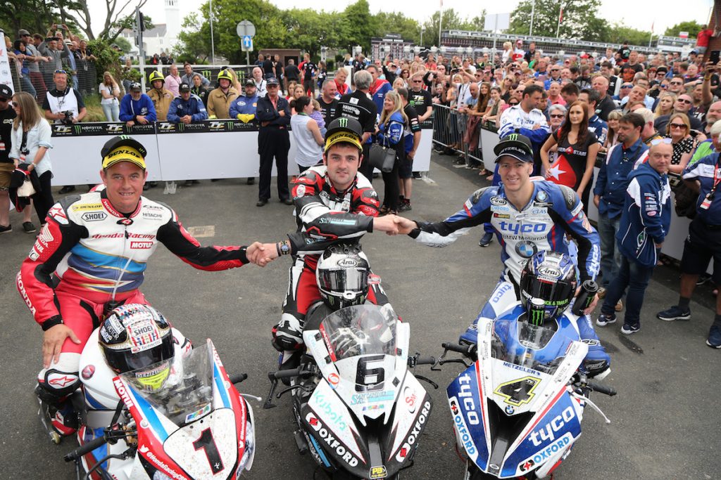 PACEMAKER BELFAST 10/06/16: Buildbase BMW rider Michael Dunlop celebrates with runner up Ian Hutchinson and third placed John McGuinness after winning the Pokerstars Senior TT at the 2016 Isle of Man TT PHOTO BY STEPHEN DAVISON