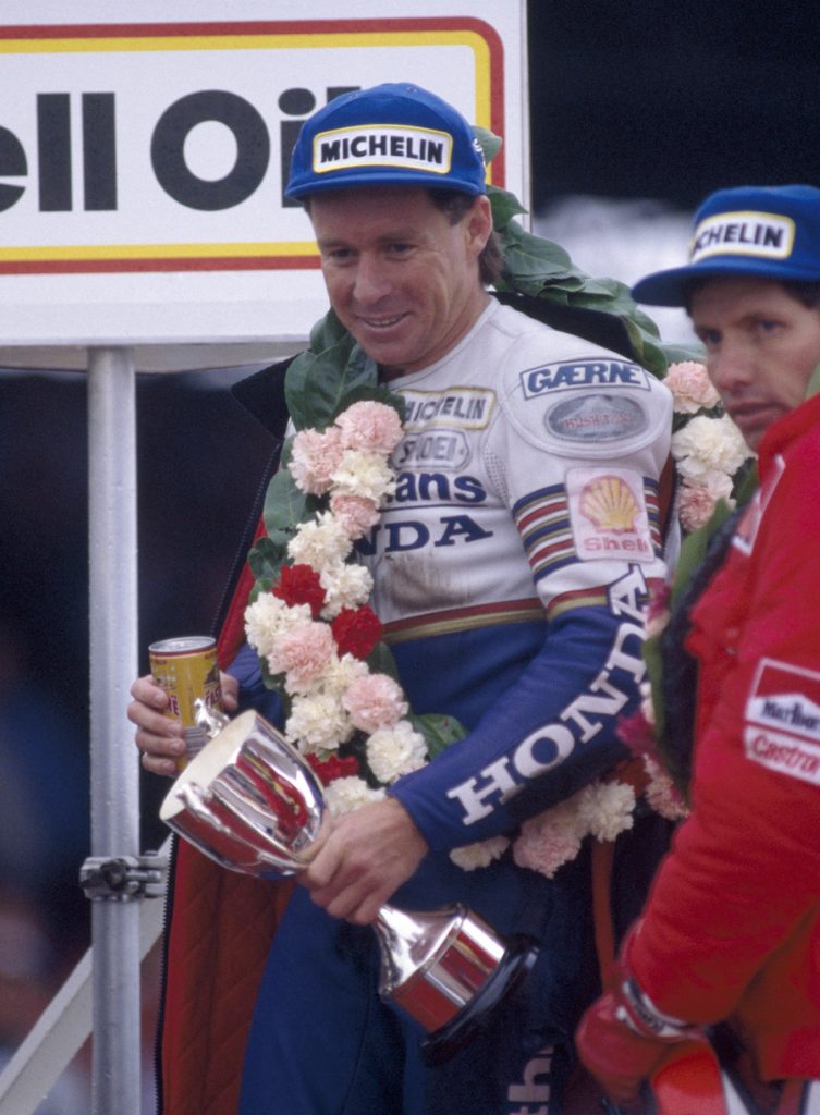 Wayne Gardner of Australia with the trophy after winning the British 500cc Motorcycle Grand Prix at Silverstone on 3rd August 1986. (Photo by Bob Thomas/Getty Images)