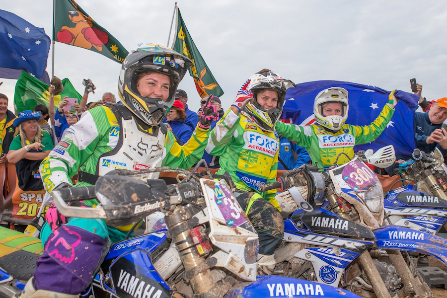 The girls celebrate their win moments after crossing the finish line from the final moto.