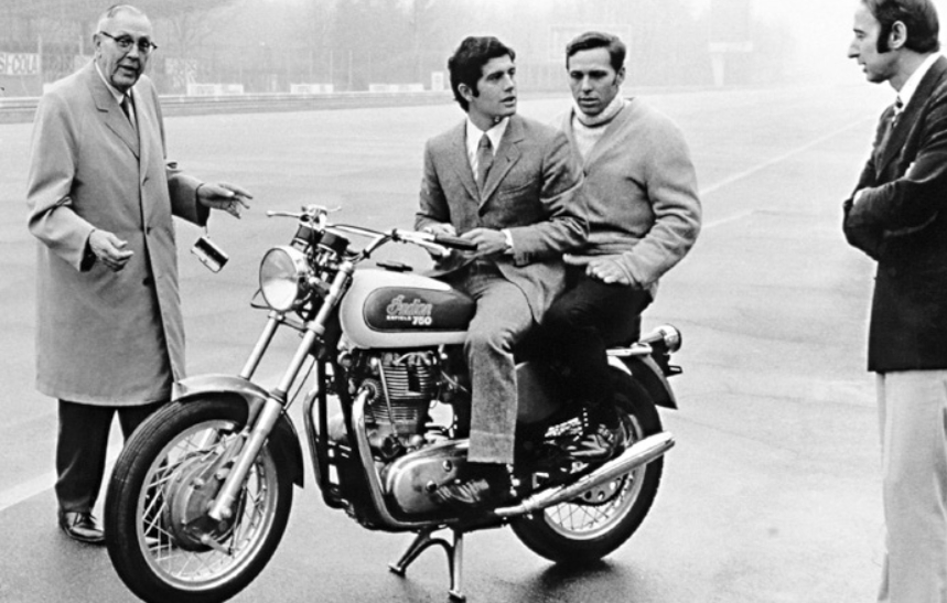 Monza 1969 and Tartarini (right) chats with Giacomo Agostini as he sits astride an Italjet Grifon