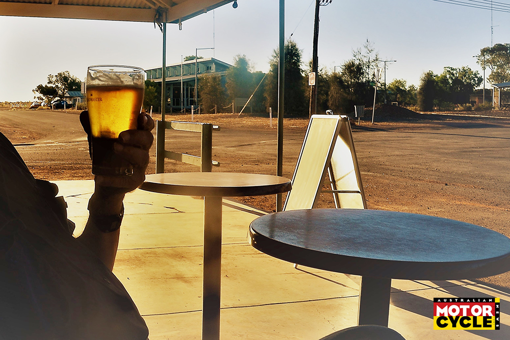 White Cliffs, NSW, Australia, April 14, 2017. Man Winding down with a Beer at Sunset in Australia's Outback Opal Mining Town of White Cliffs